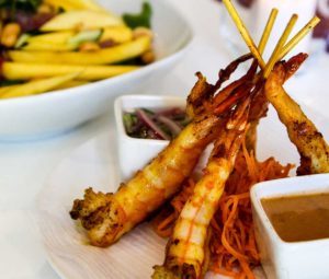 A plate of 3 Fried Tiger Shrimps served with plum sauce and sweet chili dipping sauce